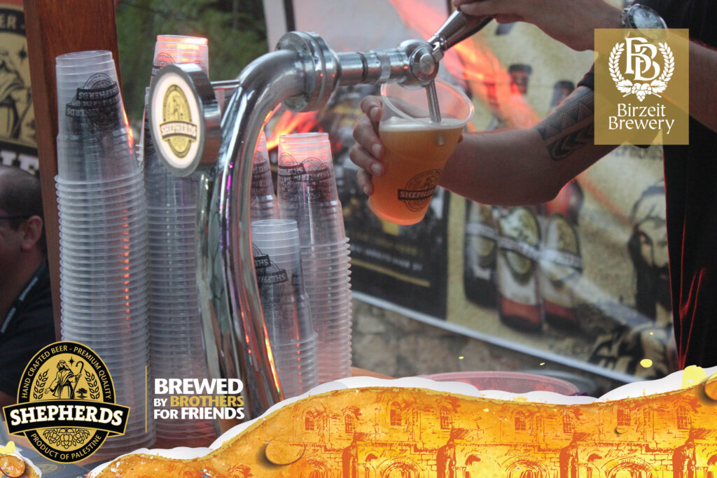 beer pouring out of a draft in Palestine at a beer festival, Birzeit Brewery